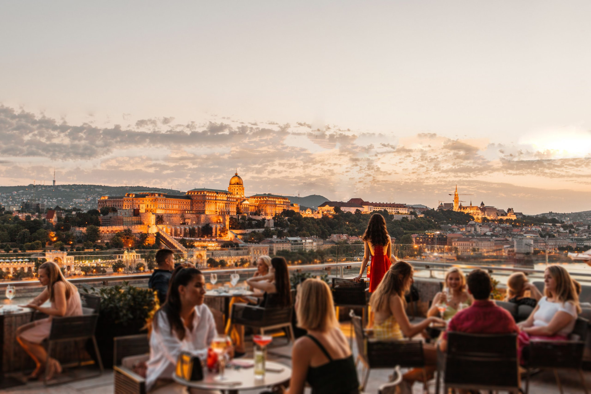Budapest rooftop terrace overlooking Buda Castle at sunset