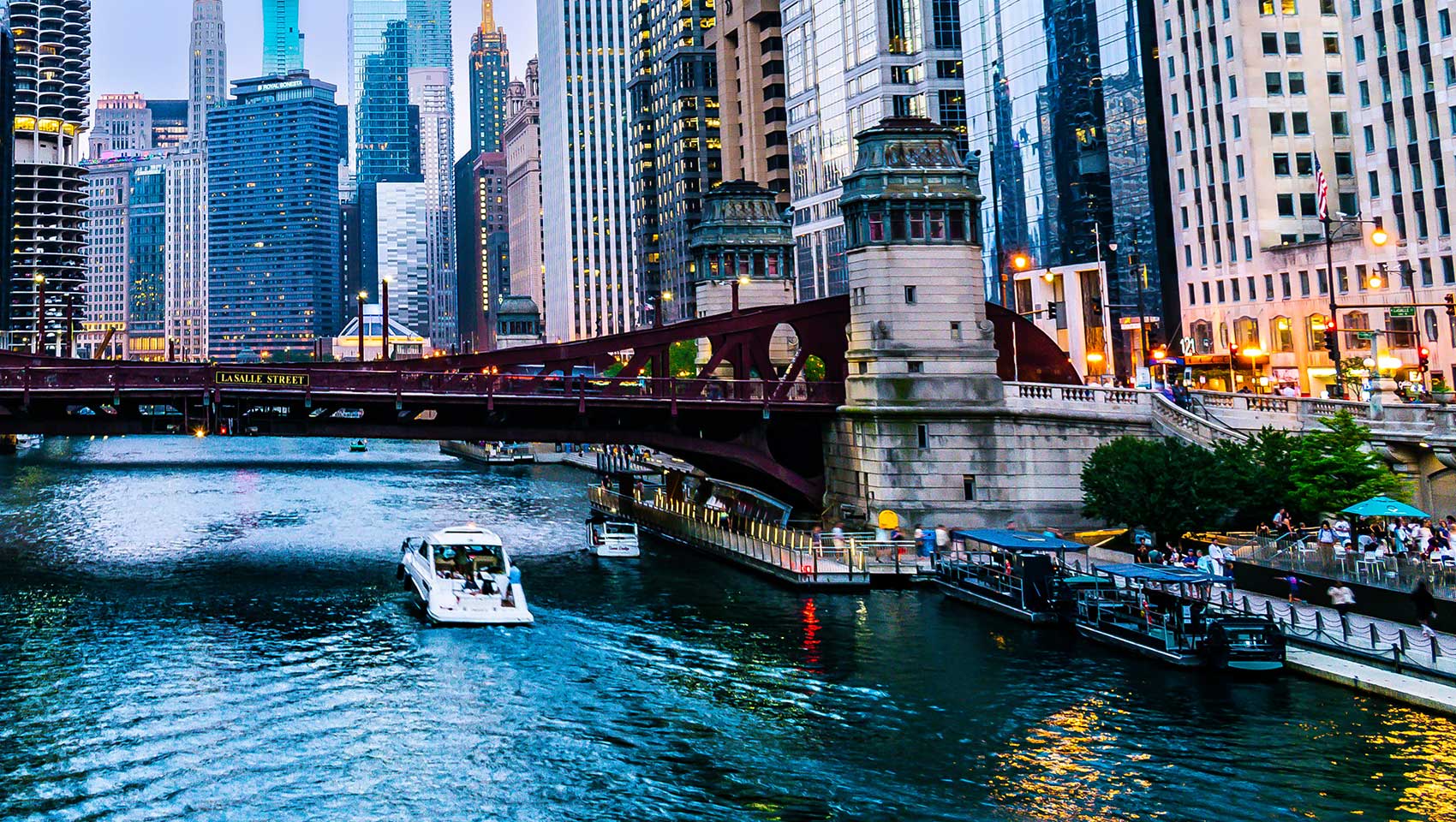 Chicago skyline along the river at golden hour