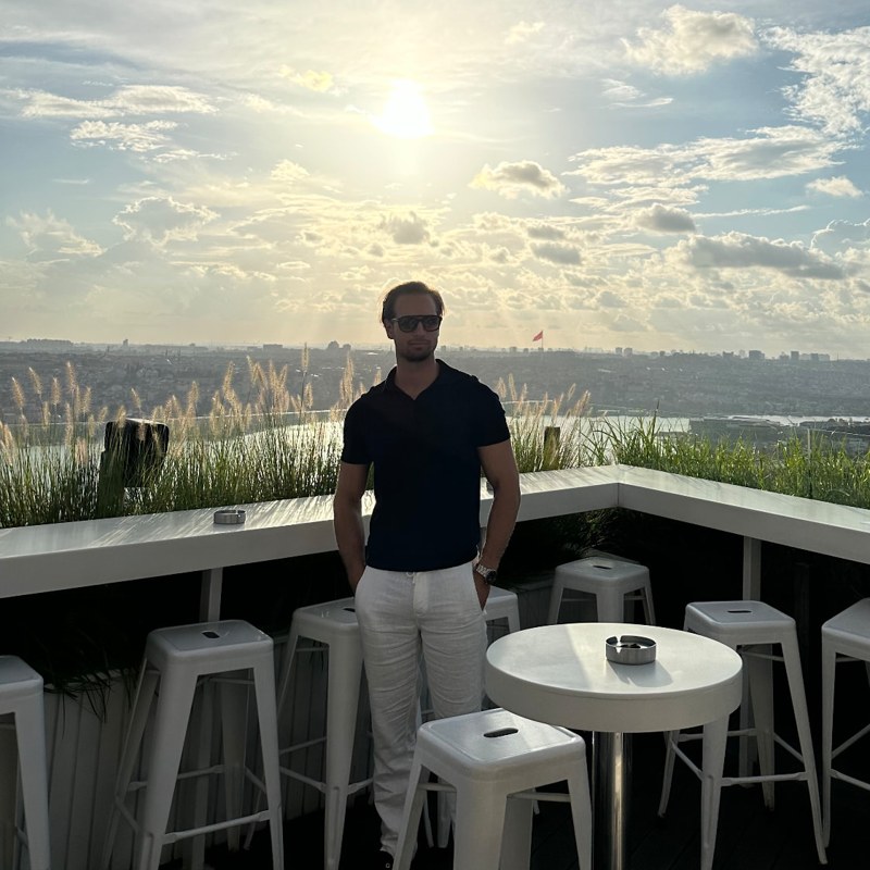 Daan on a rooftop terrace overlooking Istanbul at sunset